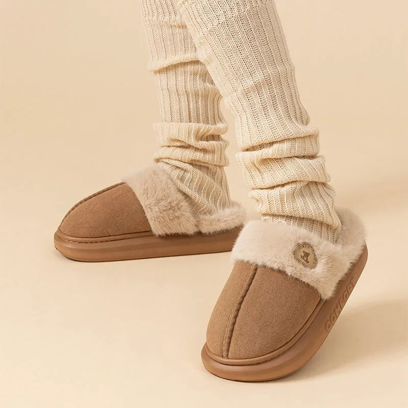 Pair of thick-soled plush fleece slippers for indoor winter wear, shown in a selected colour.