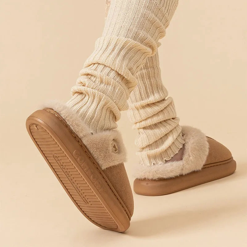 Pair of thick-soled plush fleece slippers for indoor winter wear, shown in a selected colour.