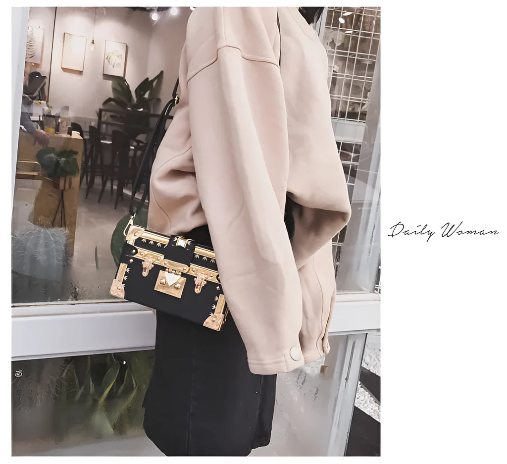 Structured hard PU women's shoulder bag with a flap, hasp closure, and adjustable strap.