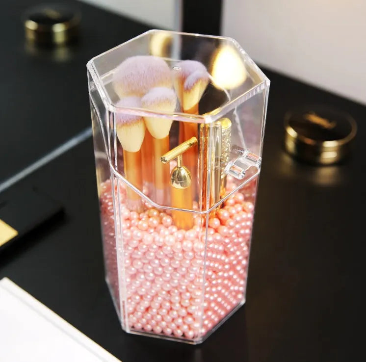Transparent acrylic makeup brush storage bucket in solid colour plastic on bedroom countertop