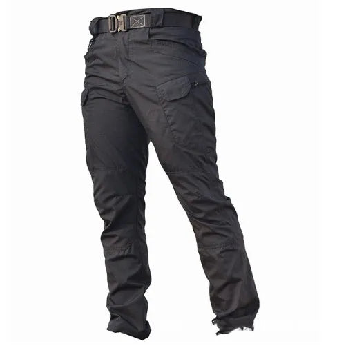 Outdoor multi-legged tactical pants in khaki cotton blend with multiple pockets on legs, shown against natural background