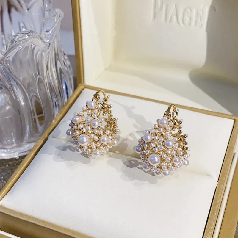 Gold-coloured copper flower basket earrings with small rice-shaped bead inlay for women