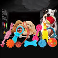 Assorted dog toy set with squeaky chicken, cotton rope knots, tennis ball, and frisbee on bright background