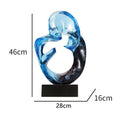Glass transparent resin craft ornament sculpture in modern simplicity style, shown in orange red and blue colour options.