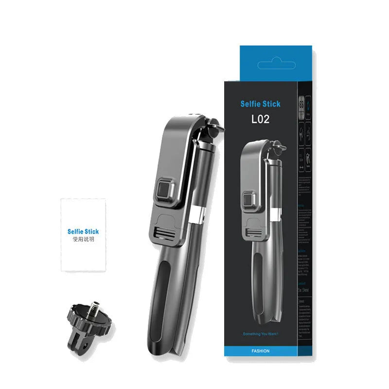 Black and white Bluetooth selfie stick with wireless remote, extended with phone mounted on 360-degree head and tripod base deployed.