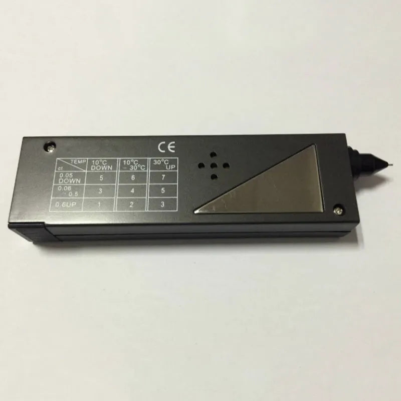 Second generation portable diamond thermal conductivity tester with metal probe on black background