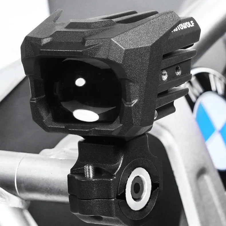 MDL5004 pair of black aluminium alloy high and low beam LED spotlights with mounting brackets on dark background