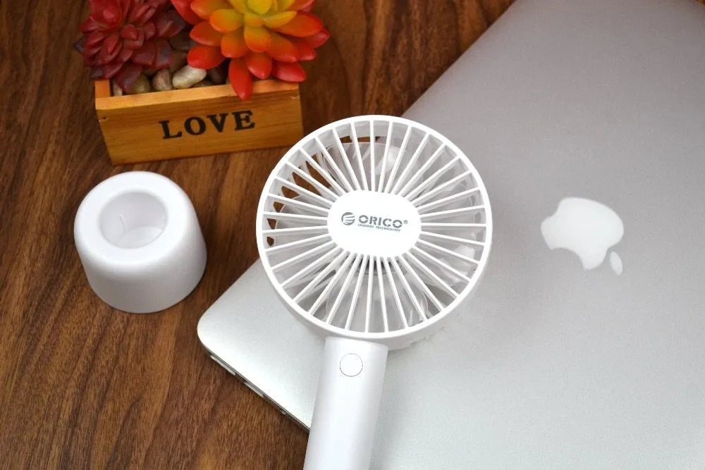 White ORICO FH1 portable USB rechargeable small fan on a desk