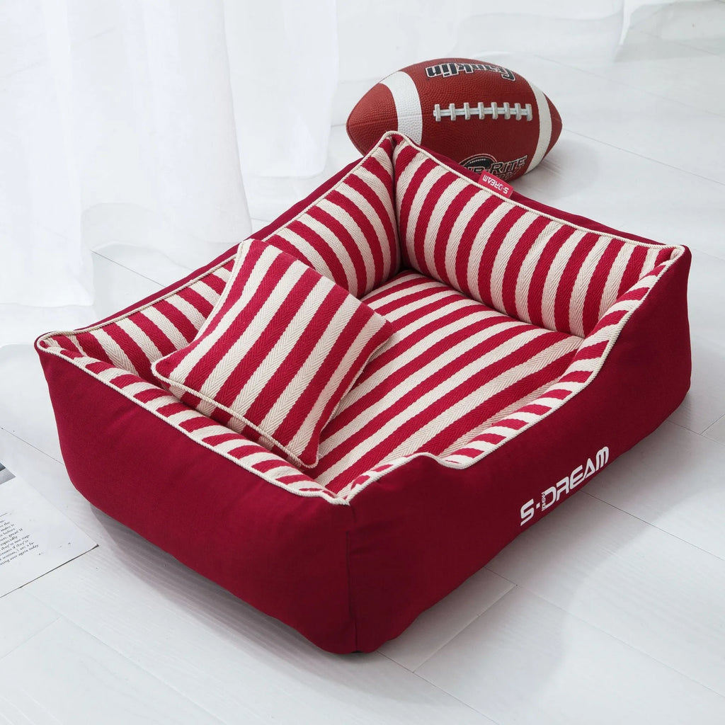 Navy stripes washable dog kennel mat with removable fabric pillow in a pet crate.