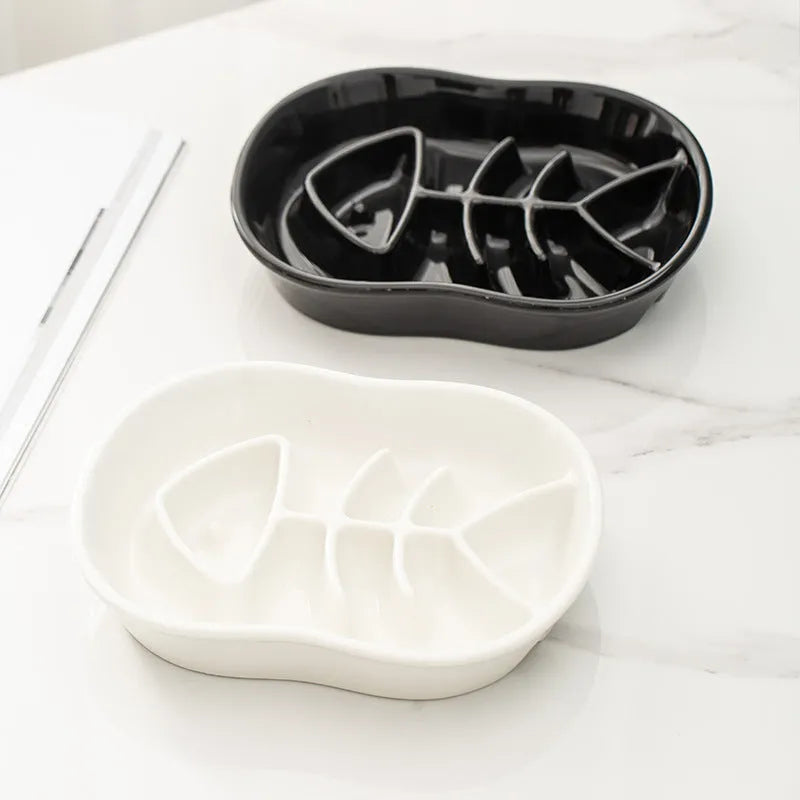 Ceramic shallow cat bowl in black on a light background, showing wide lip and low profile for whisker comfort