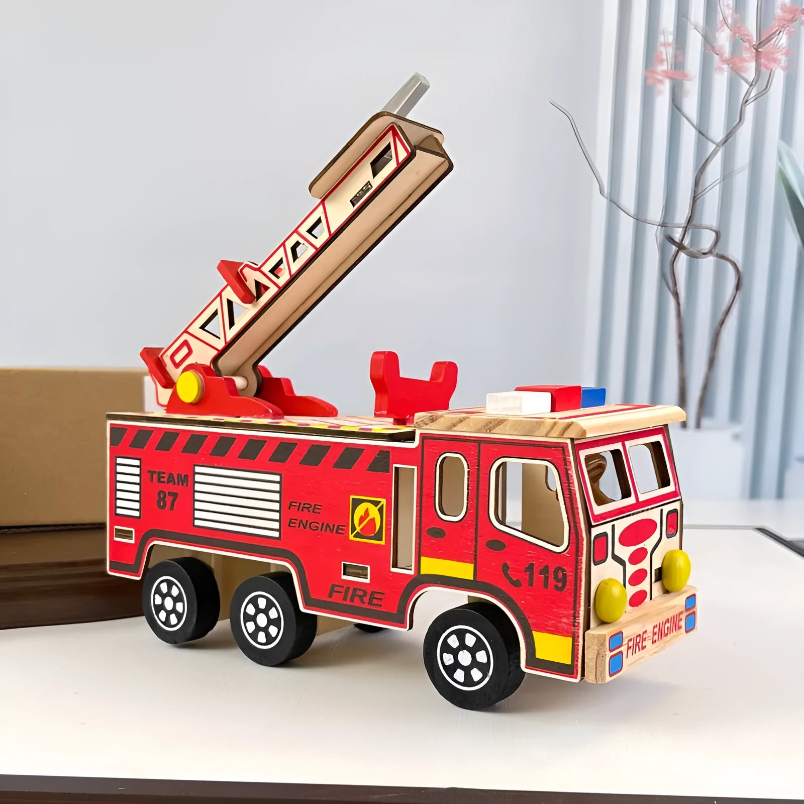 Colourful wooden fire truck model toy on a white background, 21.5cm long, bright default colour