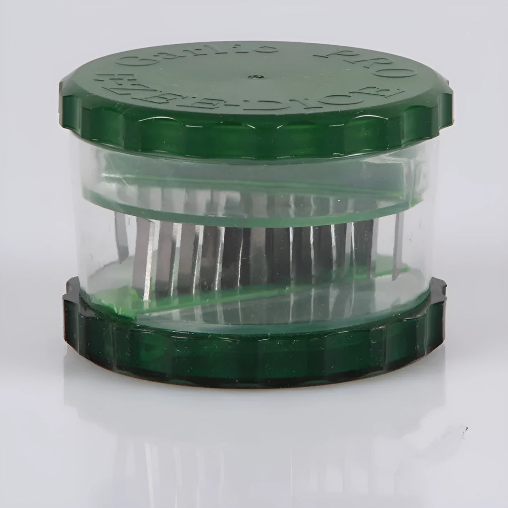 Green transparent PP plastic garlic peeler, 8.5 x 8.5 x 6 cm, on kitchen surface