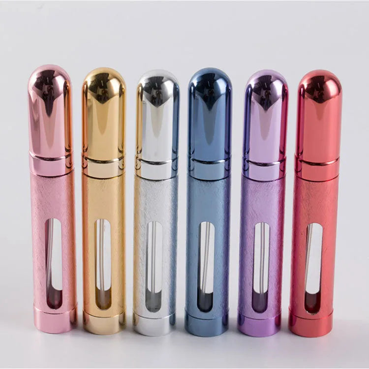 Slender 12ml aluminium portable perfume atomiser in six colours with a glass liner, shown next to a ruler indicating its 115mm height.