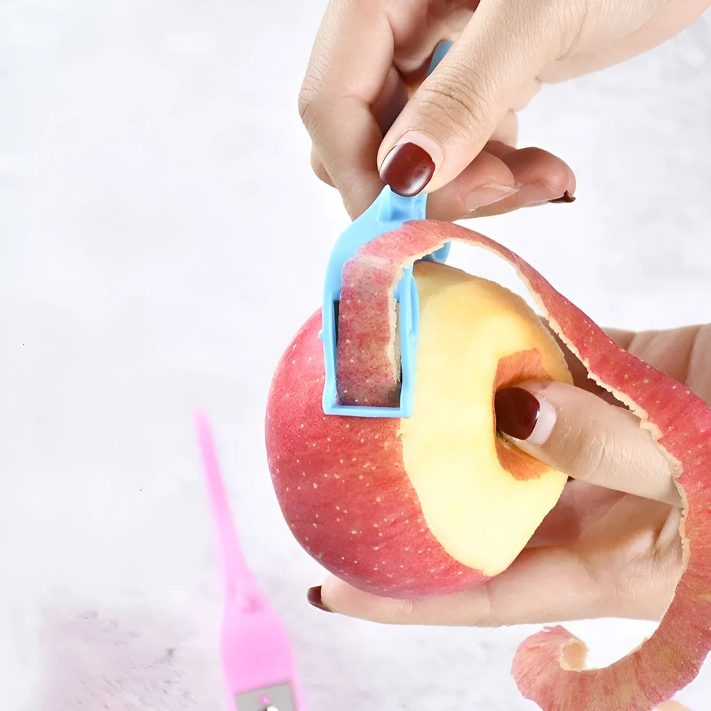 Multifunctional finger ring fruit peeler with stainless steel blade in orange, blue, and pink colours