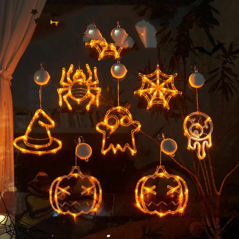 Seven Halloween LED hanging lights with spider, pumpkin and ghost designs featuring suction cups
