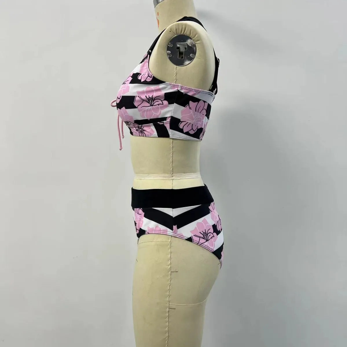 Black women's split bikini with printed belly coverage design for swimming