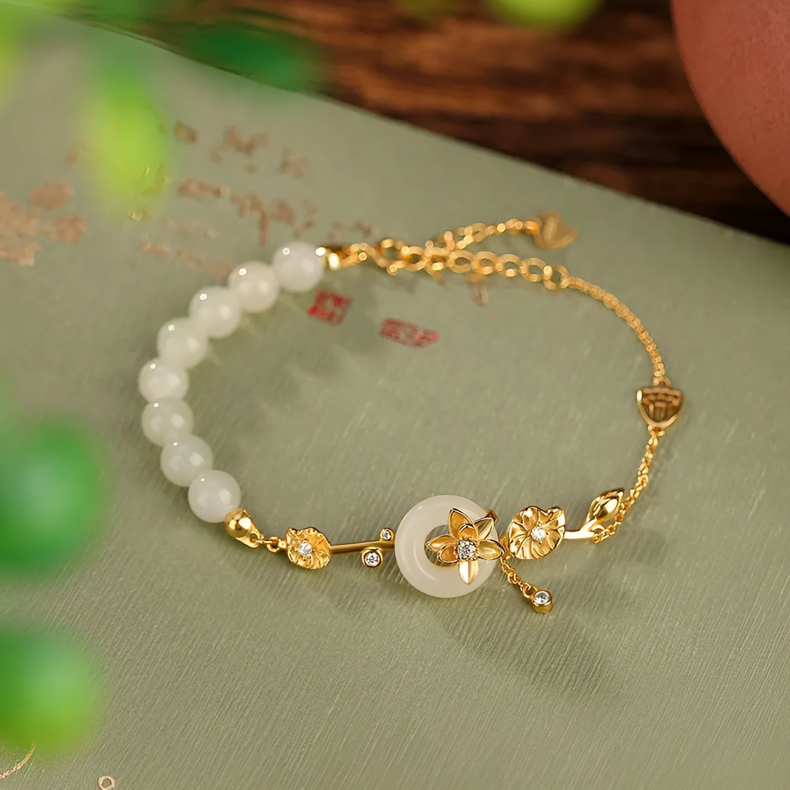 Women's silver bracelet with Hetian jade peace buckle design in gold or silver plating