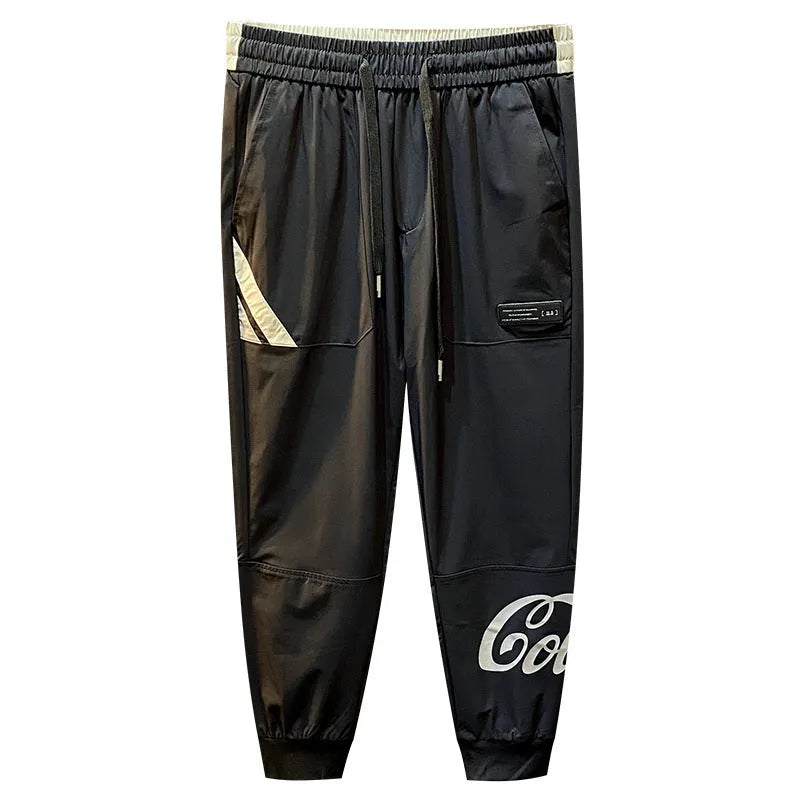 Men's black ultra-thin ice silk ankle banded cropped trousers on hanger