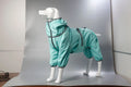 Red cotton-padded dog winter shell jacket on a mannequin, showing sizing for chest and body length.