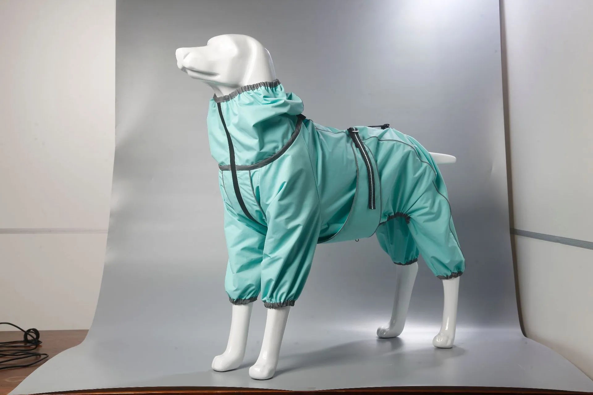 Red cotton-padded dog winter shell jacket on a mannequin, showing sizing for chest and body length.