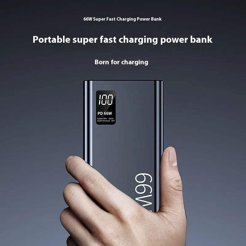 Black 50000 mAh 66W super fast charge power bank with plastic shell and USB Type-C cable on white background