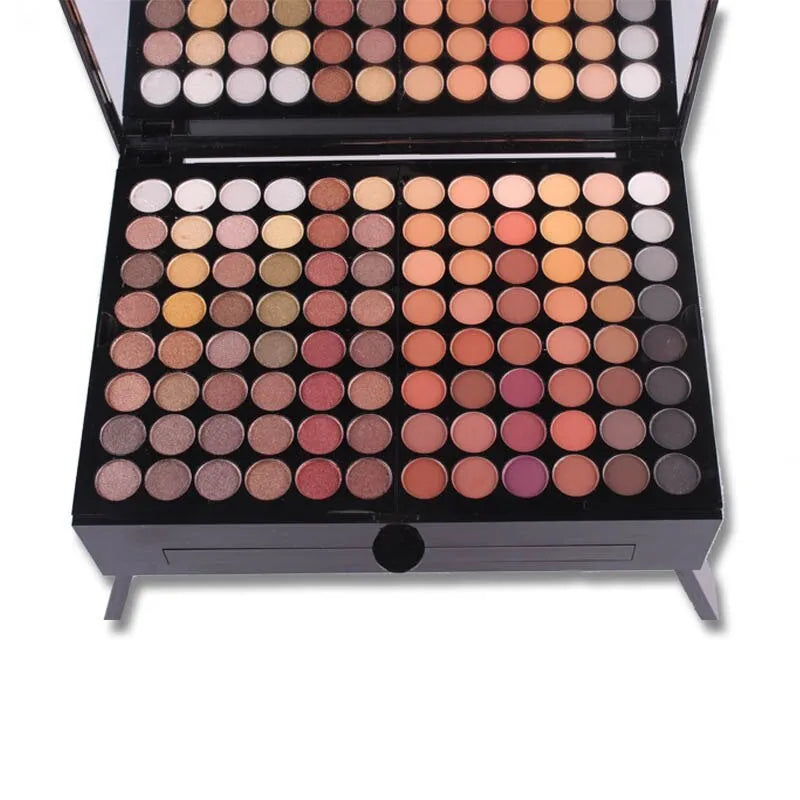 Piano-shaped makeup palette open to show 190 colour pans including eyeshadows, blushes, and powders.