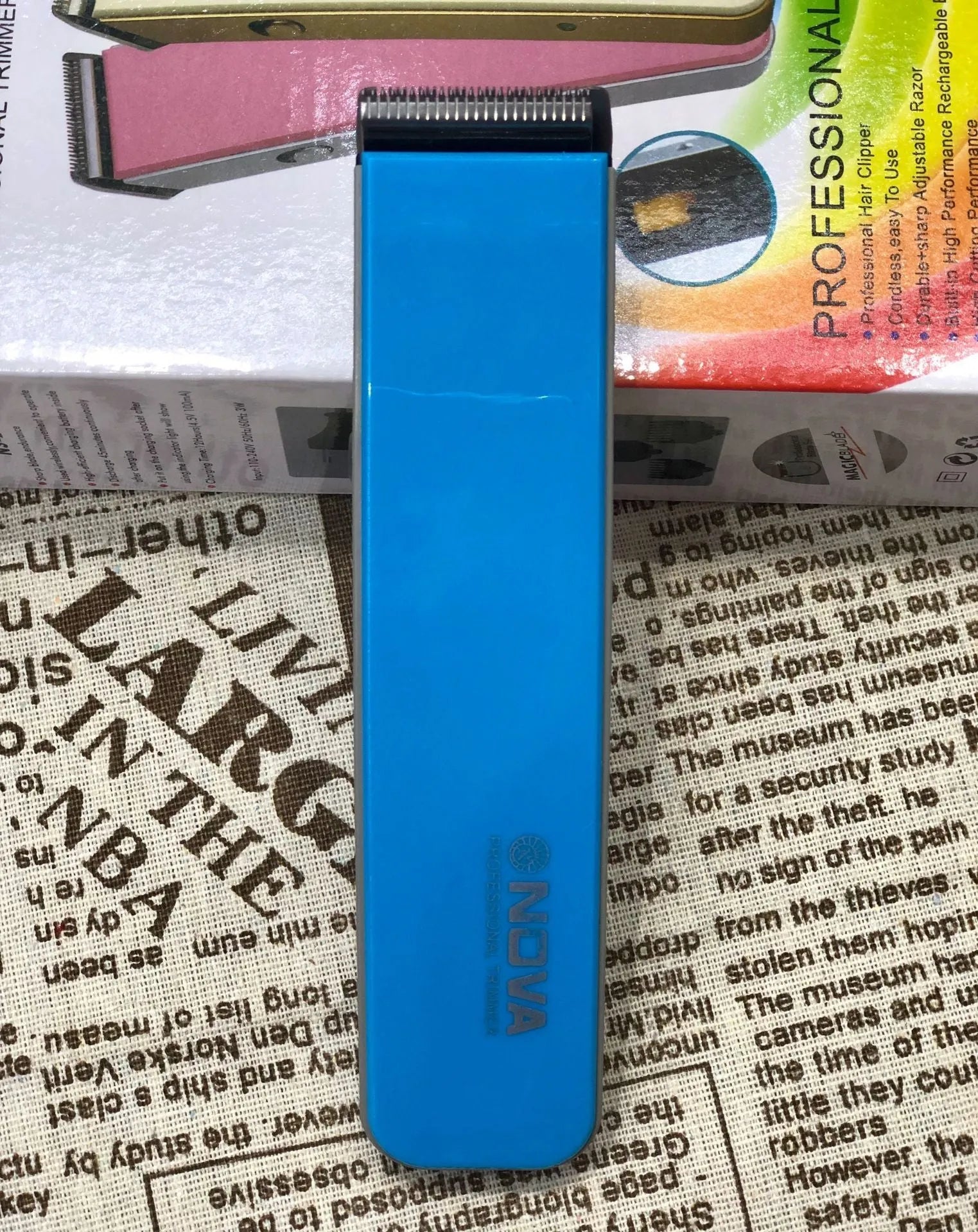 Rechargeable electric hair clipper in multiple colours with removable blade head, showing dimensions.