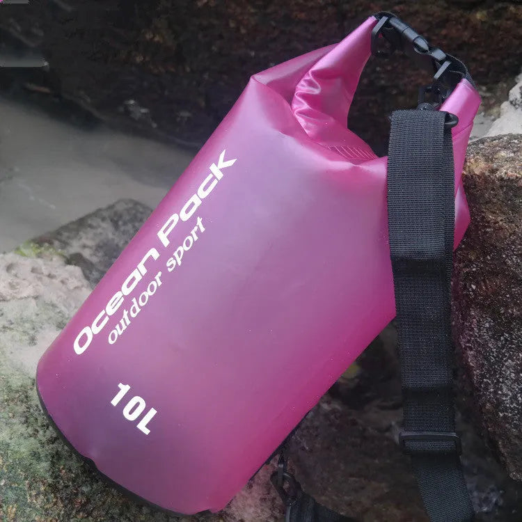 Waterproof PVC bucket bag in blue on beach, 15L size showing drawstring closure and bucket shape