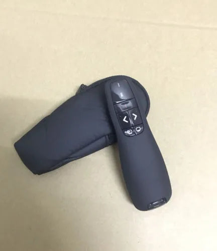 2.4GHz wireless presentation remote with laser pointer and USB receiver storage, 11.2cm length