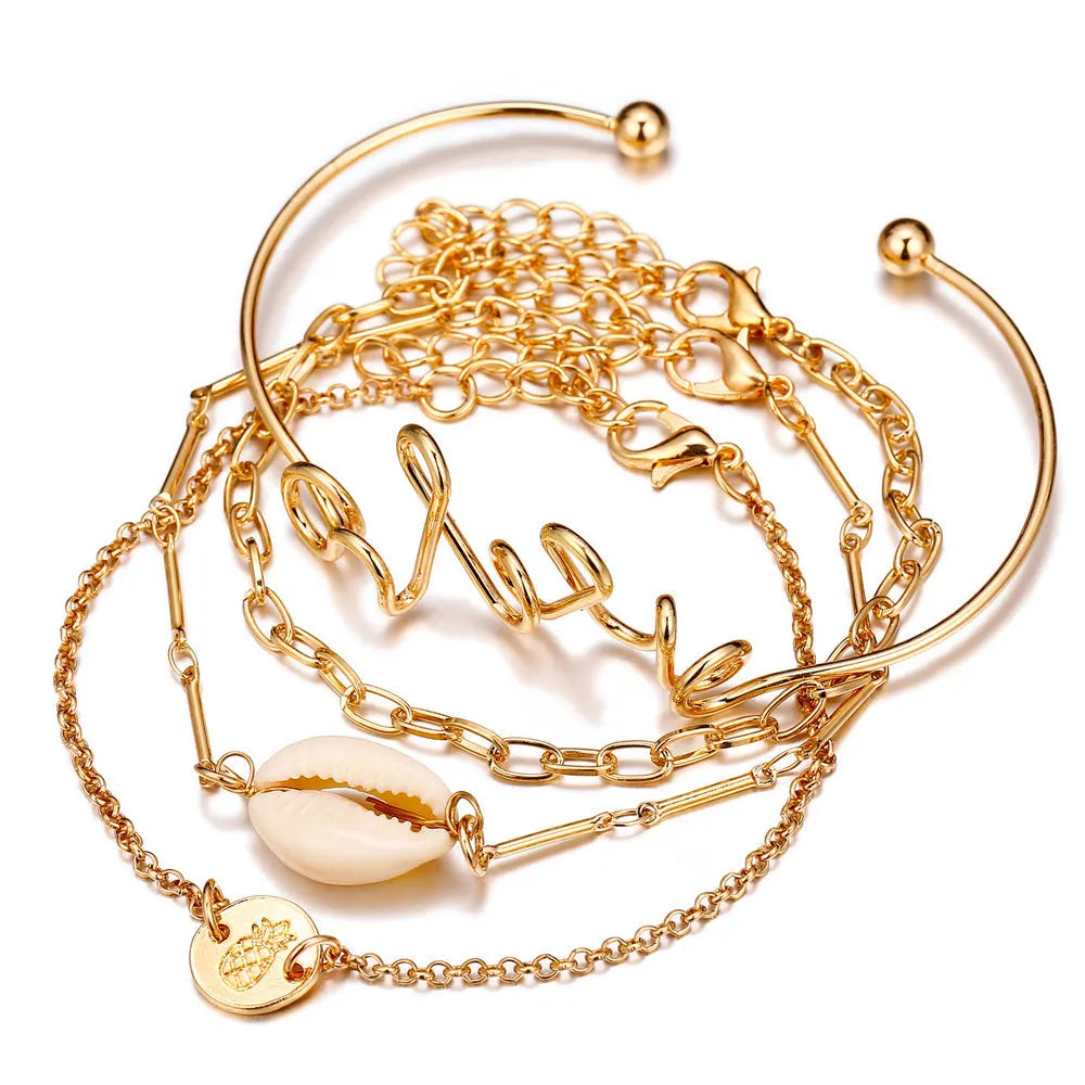 Set of four alloy bracelets in multicolour designs arranged in a gift box