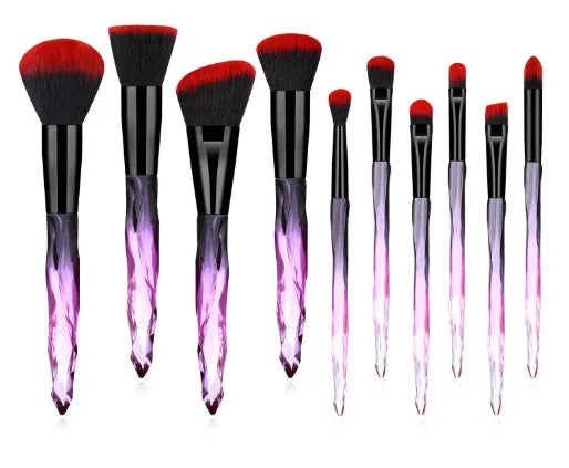 Set of ten clear crystal handle makeup brushes with diamond shank detail and artificial fibre bristles.