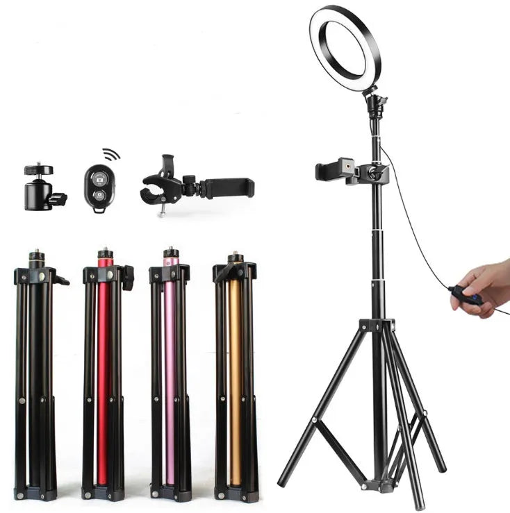 26cm RGB ring light set with tripod, selfie stick, and Bluetooth remote on a desk