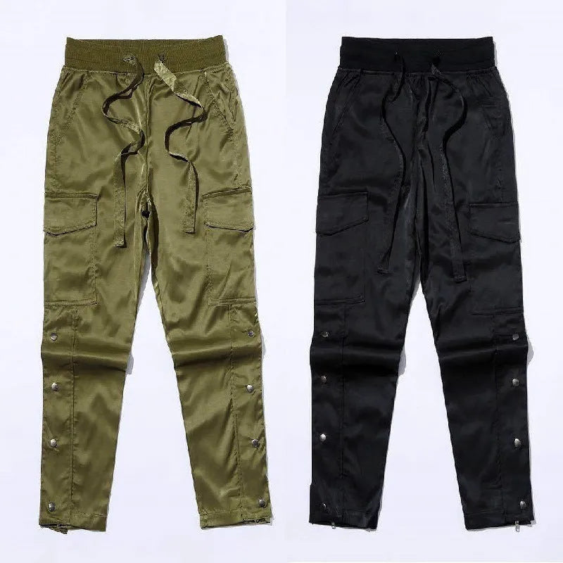 Men's cotton cargo pants with green colour, straight leg, and Velcro button closure on black background
