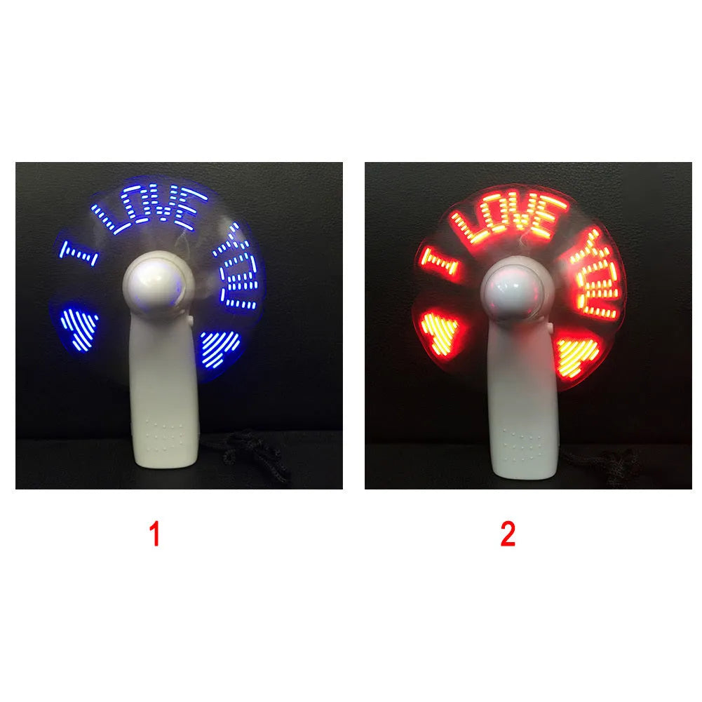 White handheld mini fan displaying a red flashing 'I Love You' LED pattern on its front panel.