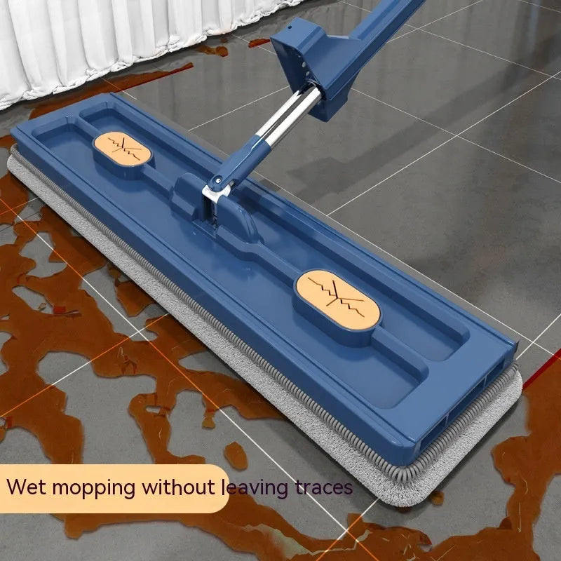 Large blue flat mop with a long silver handle showing the rotating head and built-in dewatering scraper.