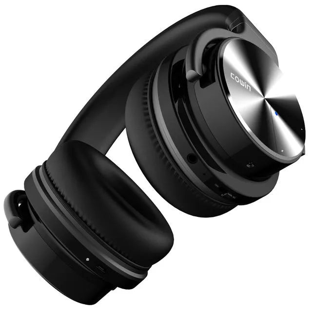 Male wireless Bluetooth headset head mounted in black with padded ear cups and adjustable headband