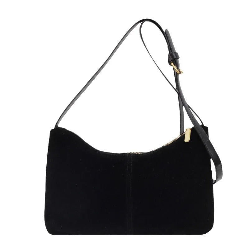 Retro suede underarm bag in black with bucket shape, sandwich pocket, and visible sewing detail