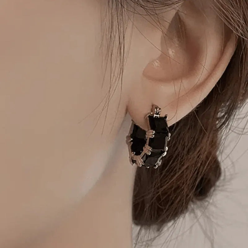 Women's geometric U-shaped earrings with crystal stones in gold electroplated copper