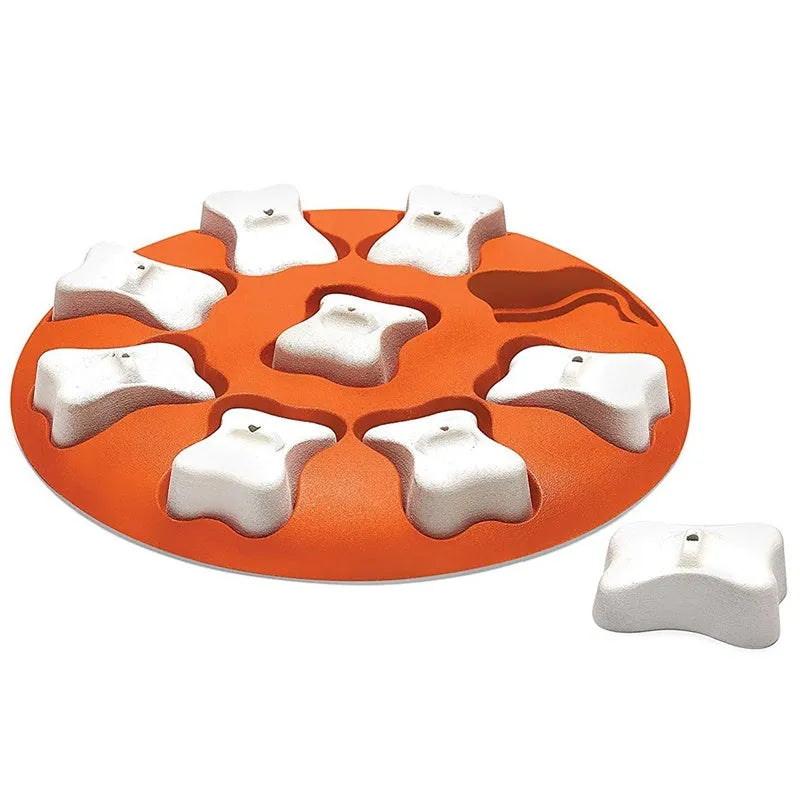 Orange and white plastic leak food puzzle toy for dogs and cats with kibble falling from opening