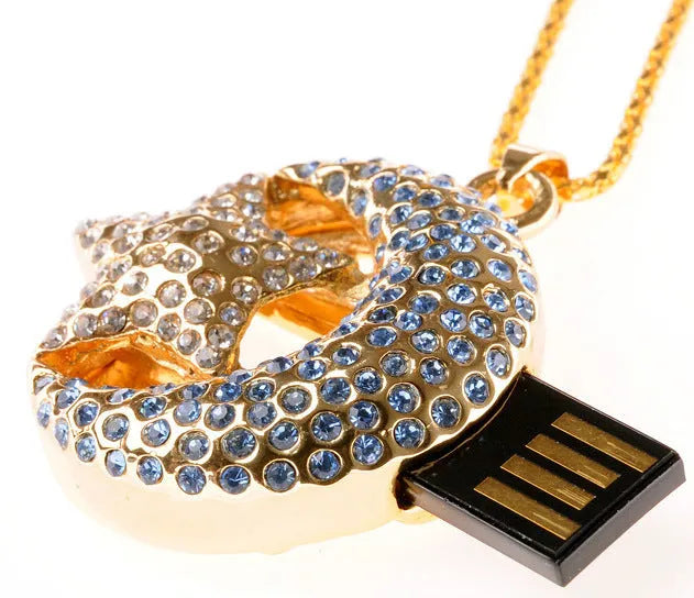 Silver metal Jewelry Xingyue USB flash drive with retractable connector on a plain background.