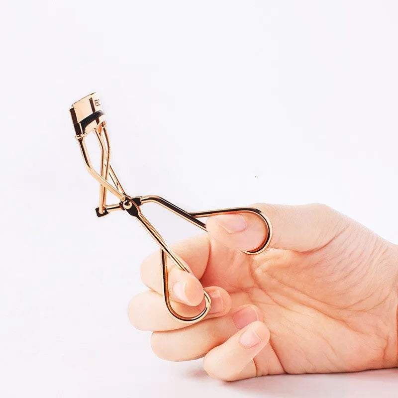 Beland Eyelash Curler G2 golden finish facial beauty tool on a white background
