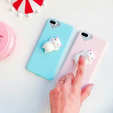 Soft silicone TPU iPhone case with a 3D cartoon cat design, shown in pink.