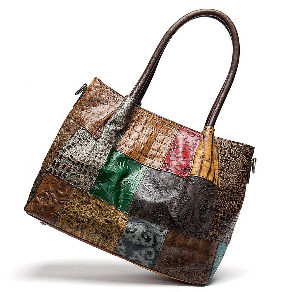 Women top layer cowhide medium handbag with contrast geometric embossing, soft handle, and open-top design