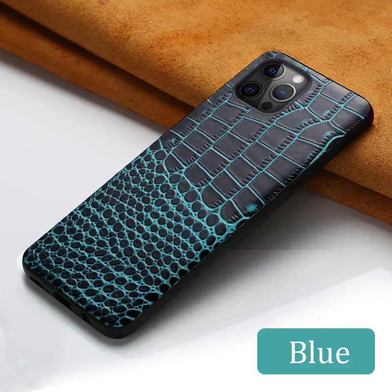 Black leather iPhone case with a crocodile pattern texture, shown fitted on a compatible phone.