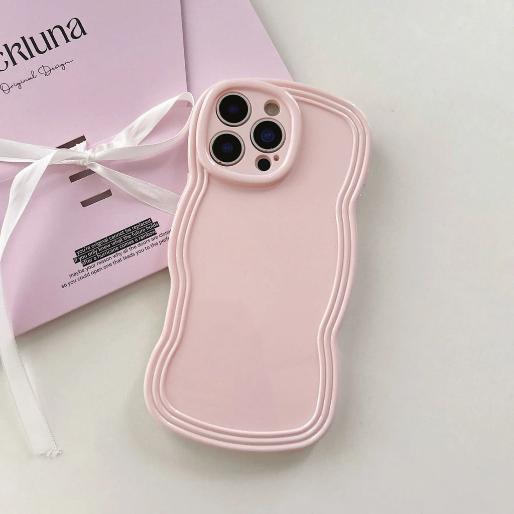 Glossy iPhone case with a soft cream and candy-colour wave pattern on a pink background.