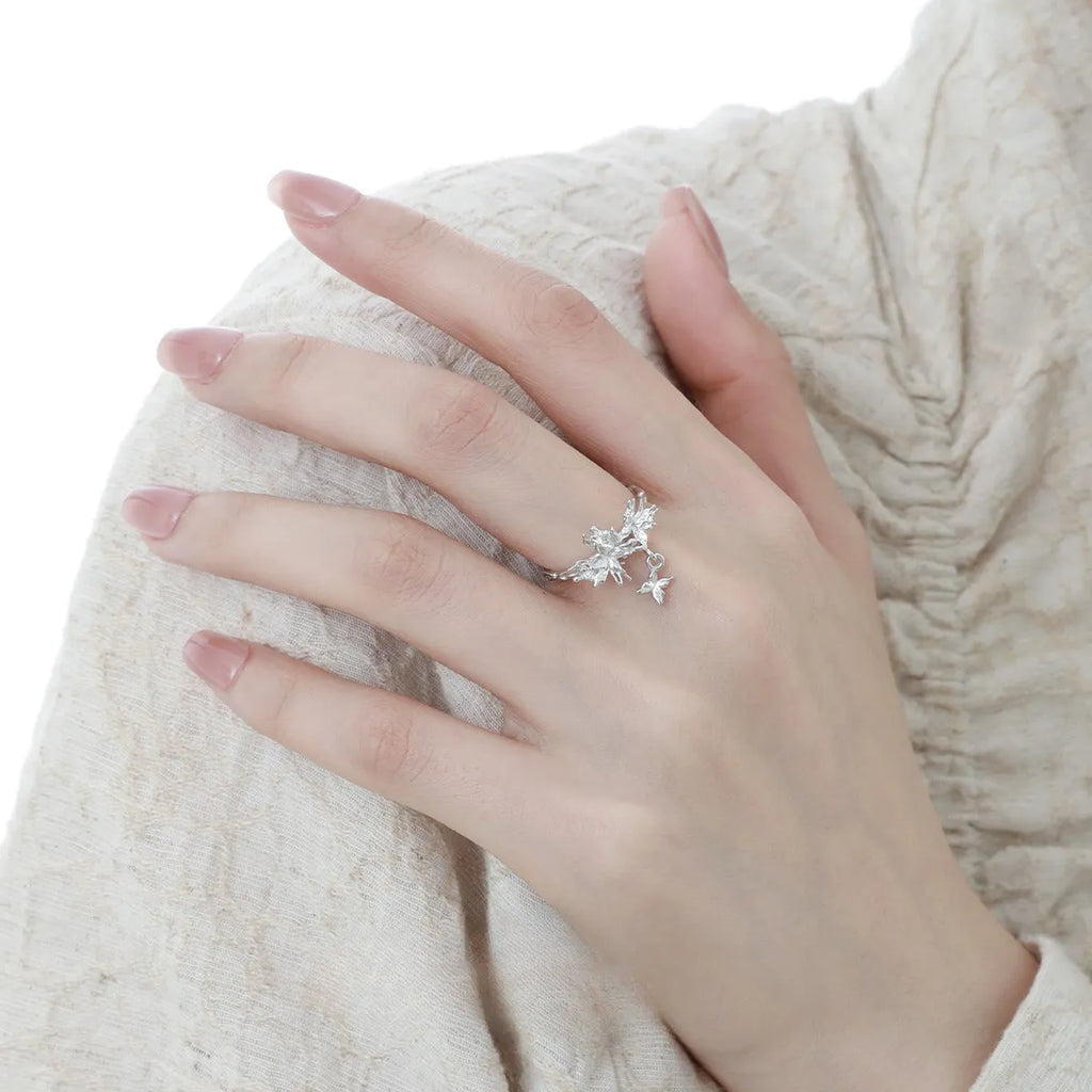 Adjustable silver ring featuring a wild butterfly design, shown in a choice of electroplated finishes.