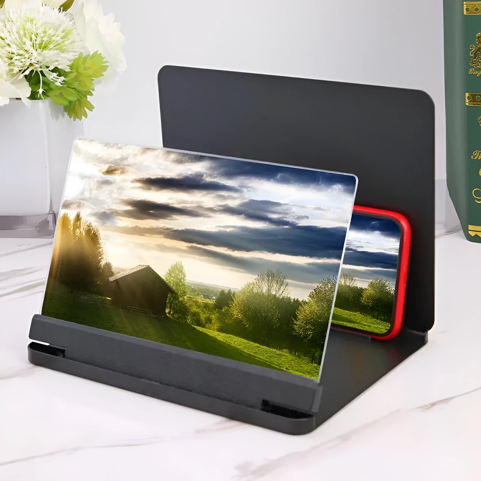 Black and white phone screen amplifier with 9 inch screen and built-in smartphone holder.