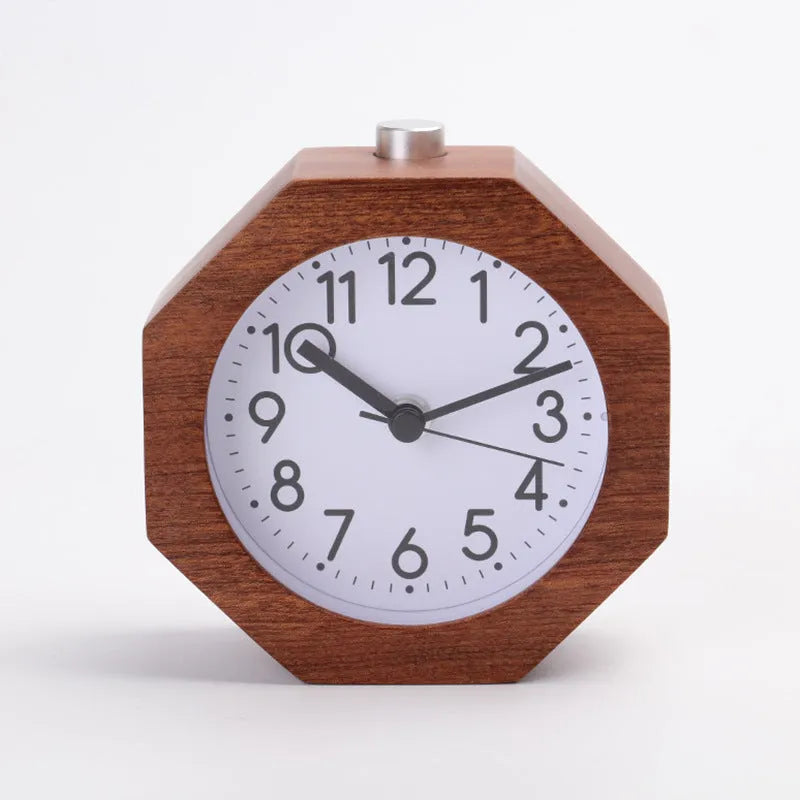 Wooden hexagonal alarm clock with luminous dial and beech finish on a nightstand