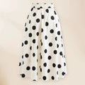 Black women's one-piece swimsuit with a white attached round skirt and a decorative bow at the front.