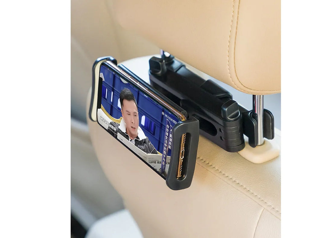 Black universal car phone holder mounted on rear seat base with tablet secured in clamp